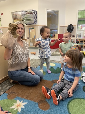 Teacher leading a circle time activity in her classroom